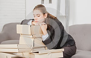 Sad busy secretary, stressed overworked business woman and folders with the documents too much work, office problem