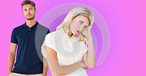 Sad caucasian couple after having an argument against purple gradient background