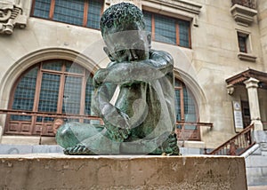 Sad Child bronze sculpture in the middle of Vitoria-Gasteiz, Spain.
