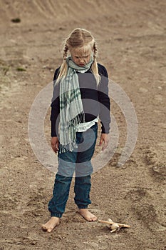 Sad child girl with airplane outdoors, stress, airophobia and airsick concept