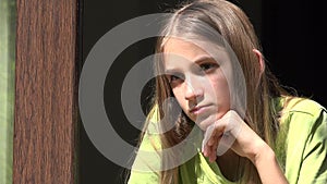 Sad Child Looking on Window, Unhappy Girl, Bored Thoughtful Kid, Teenager Face, Isolated People at Home in Coronavirus Crises