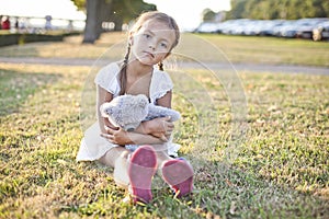 Sad child in a park