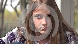 Sad Child, Unhappy Kid, Thoughtful Bullied Girl in Park, Depression of Adolescents, Children Expression in Coronavirus Pandemic