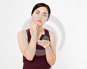 Sad chinese girl,woman hold phone isolated on white background, copy space