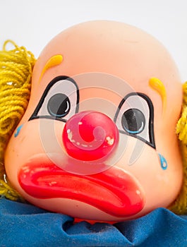 Sad clown face doll head