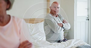 Sad, conflict and senior couple in bedroom, marriage crisis and fight in home. Bed, frustrated elderly man and woman