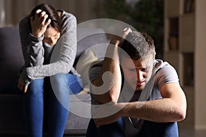 Sad couple after breaking up photo