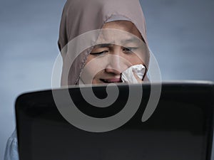 Sad Crying Muslim Businesswoman to See Bad Financial Loss Report on Laptop