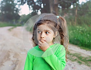 Sad cute little girl looking sad and afraid