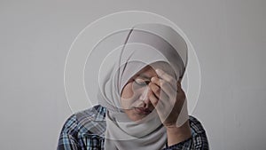 Sad depressed anxiety Asian muslim woman thinking contemplating bad thing happened in her life, stress exhausted feeling down