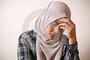 Sad depressed anxiety Asian muslim woman thinking contemplating bad thing happened in her life, stress exhausted feeling down