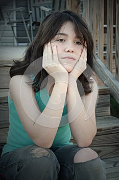 sad depressed teen girl on stairs