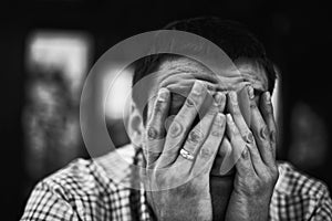 Sad and depressed young man covering face - Feeling depressed background concept - Marriage Failure Concept - Depressed Adult