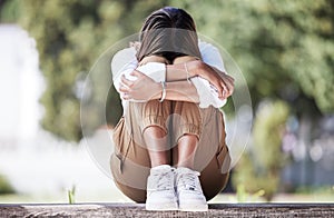 Sad, depression and student with woman in park for cry, frustrated and stress. Mental health, anxiety and fear with