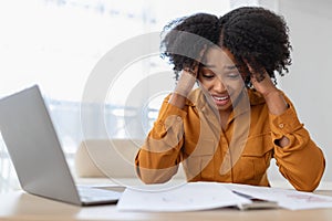 Sad despaired millennial curly black lady student manager has stress with computer