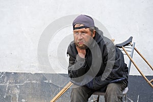 Sad disabled homeless man