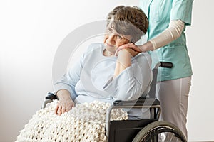 Sad disabled senior woman