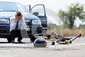 Sad driver after collision with bicycle