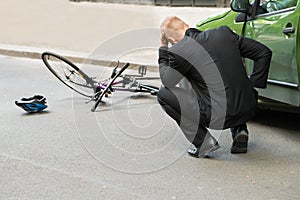 Sad driver after collision with bicycle