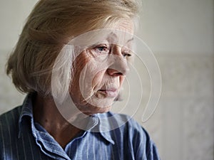 Sad elderly woman