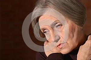 Sad elderly woman