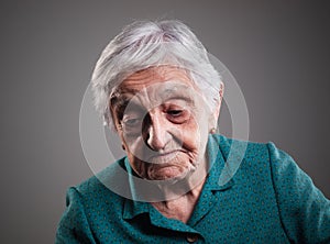 Sad elderly woman