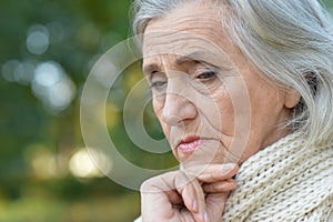Sad elderly woman close-up