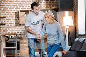 Sad elderly woman getting help from her social worker