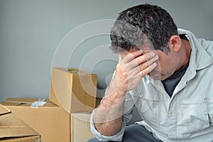 Sad evicted man worried relocating house photo