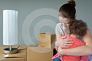 Sad evicted mother with child worried relocating house photo