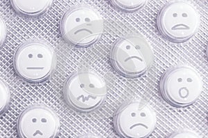 Sad face of pills photo