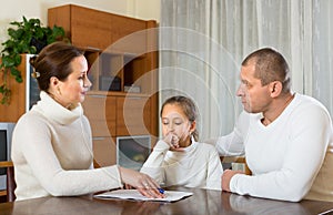 Sad family having financial problems photo