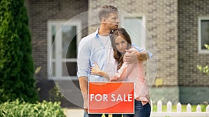 Sad family hugging, sale signboard, have to sale their big house, crisis