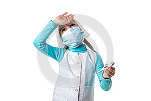 Sad female nurse in medical gown with thermometer. Focus on clinical thermometer with high fever temperature isolated on
