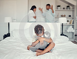 Sad, fight and boy on the bed with parents in conflict depression, anxiety and stress in their family home. Fear, scared