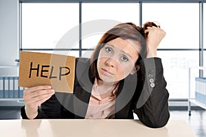 Sad and frustrated business woman working in stress at modern office rwindow room asking for help overworked