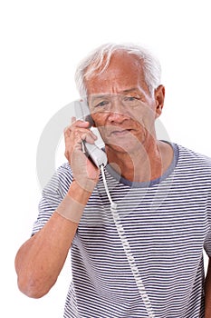 Sad, frustrated, negative senior old man using telephone