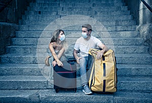 Sad and frustrated tourist couple not able to travel abroad due to post covid travel restrictions