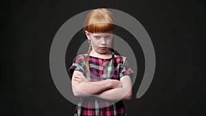 Sad ginger girl, she is looking displeased and offended