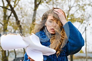 Sad girl burn white paper at forest