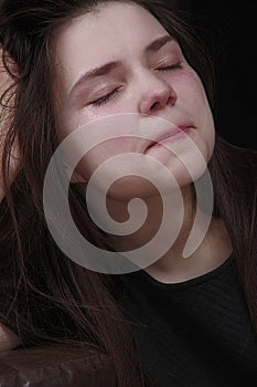 Sad girl crying tears. Maiden sadness.