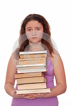 Sad girl holds stack of books.