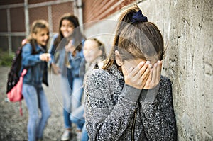 A sad girl intimidation moment on the elementary Age Bullying in Schoolyard