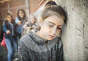 A sad girl intimidation moment on the elementary Age Bullying in Schoolyard