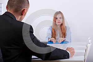 Sad girl listening to employer