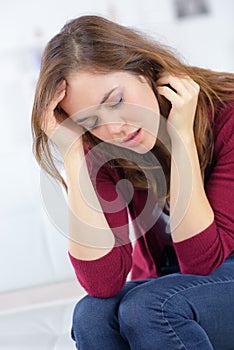 Sad girl with migraines