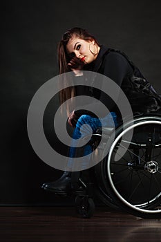 Sad girl on wheelchair.