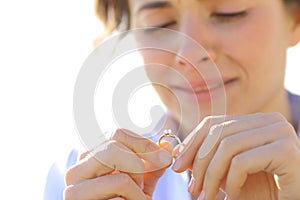 Sad girlfriend looking her engagement ring