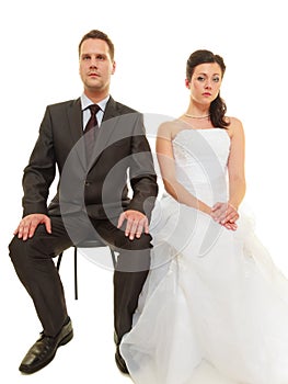 Sad groom and bride couple waiting for wedding