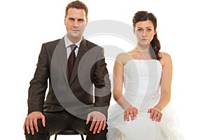 Sad groom and bride couple waiting for wedding